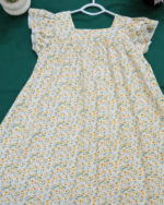 Beautiful floral cotton frock for girls with flutter sleeves and square neckline.