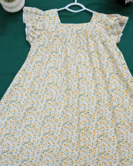 Beautiful floral cotton frock for girls with flutter sleeves and square neckline.